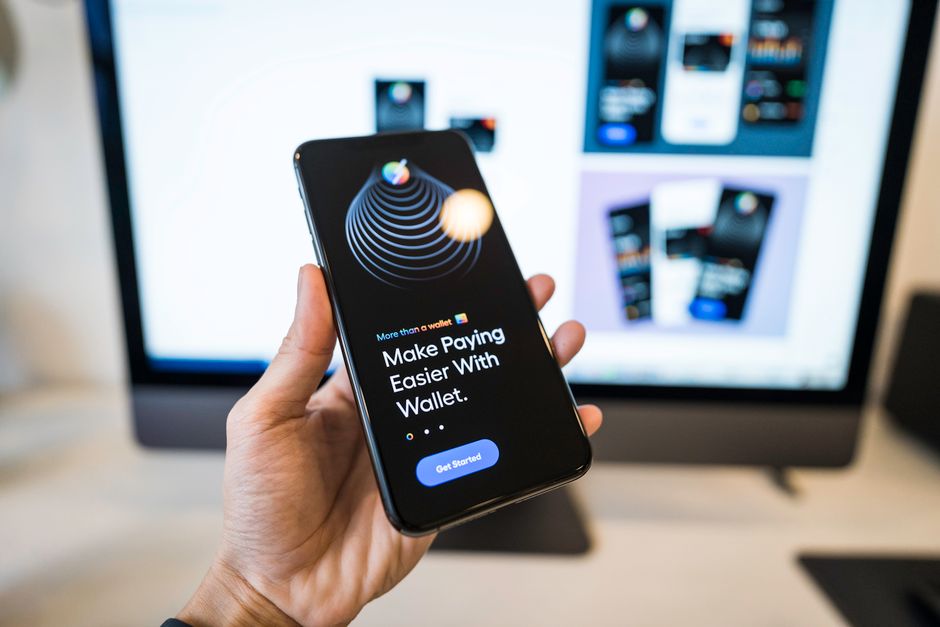 A person completing a payment in a wallet app on their phone